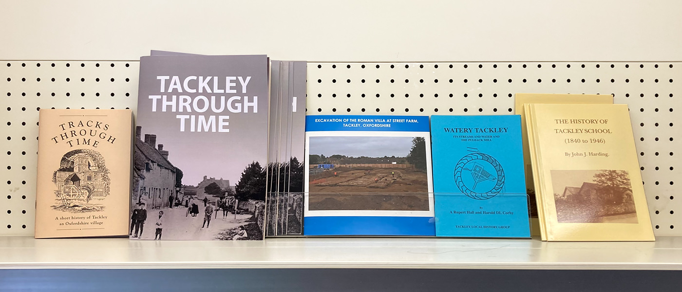 Five of the History Group's publications displayed on a shelf in the village shop.